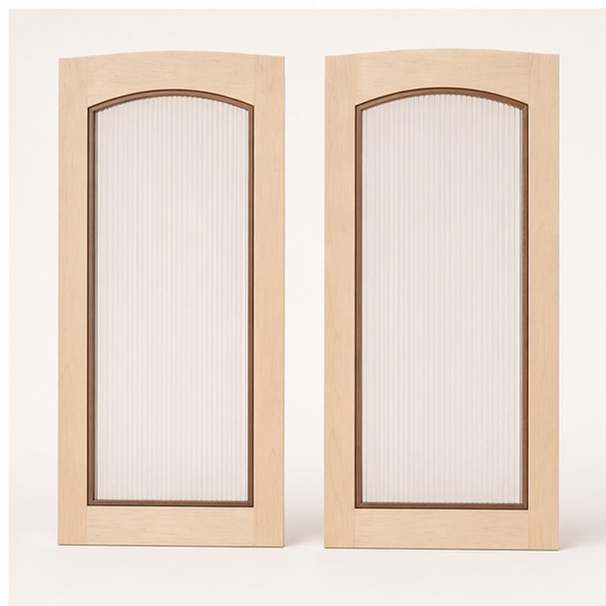 Pair of hard maple arched cabinet doors with fluted inserts and walnut bead detail