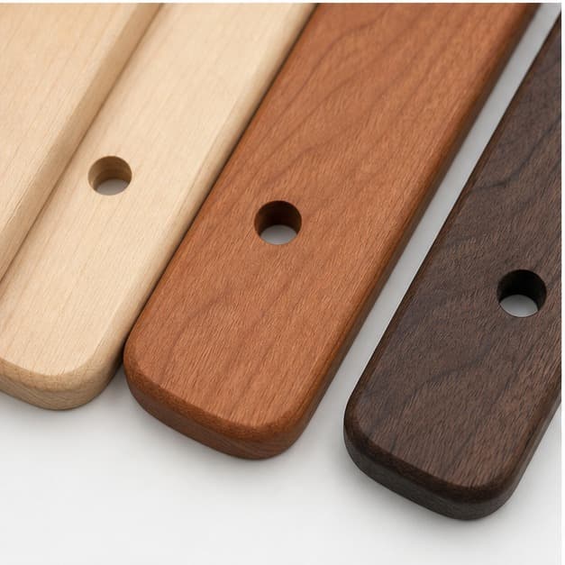 Close grain and material detail of Custom Cabinet Pull Hole-Cover Backplate Set