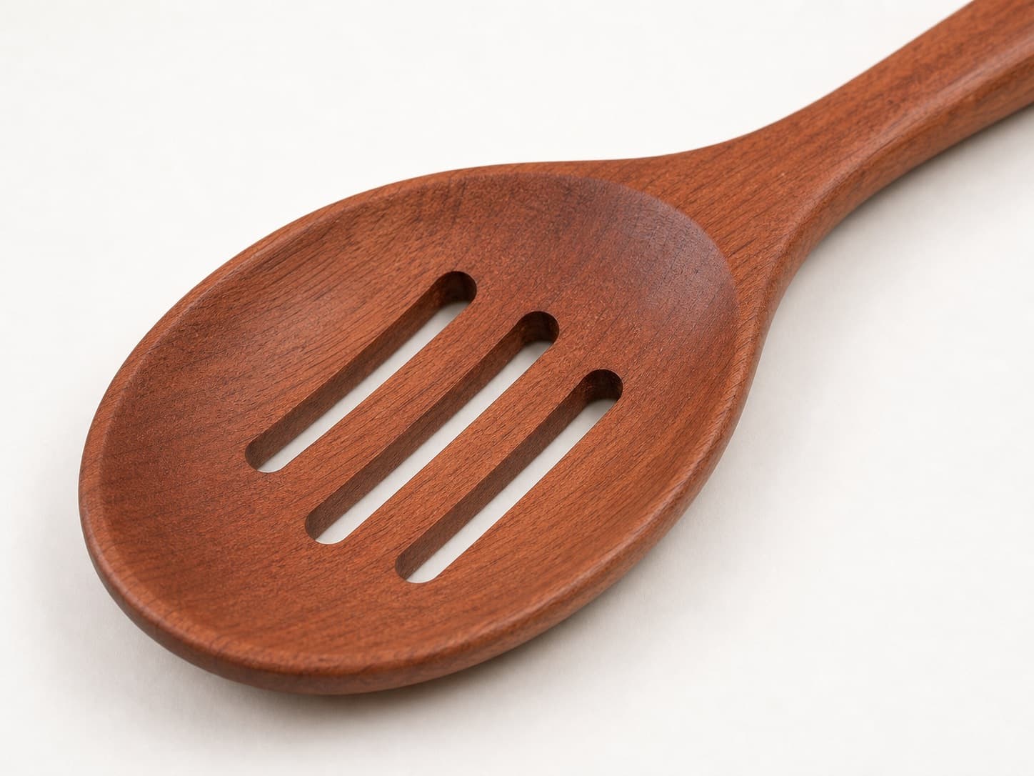 Close grain and material detail of Slotted Cooking Spoon