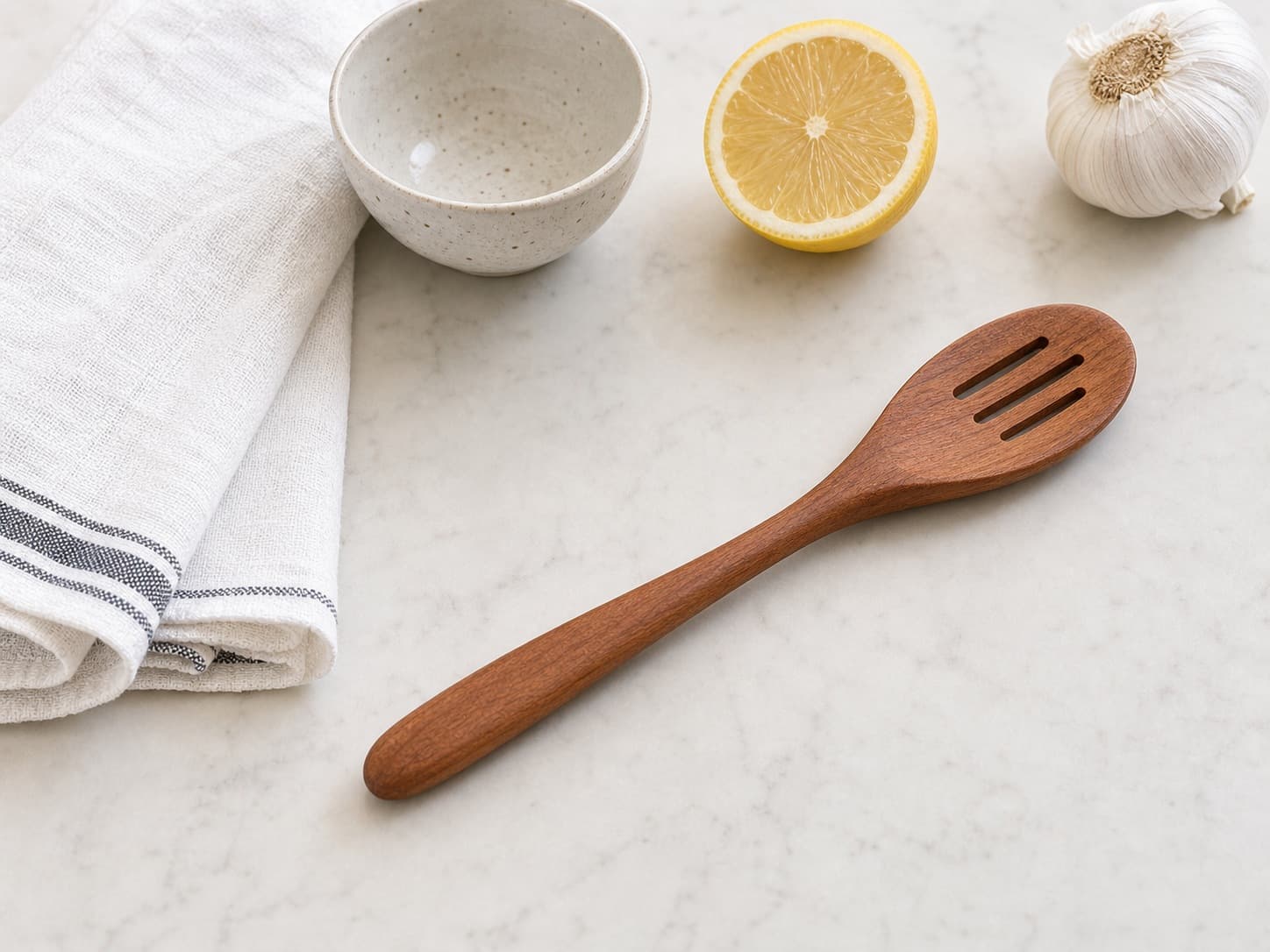 Slotted Cooking Spoon shown with everyday kitchen items for scale