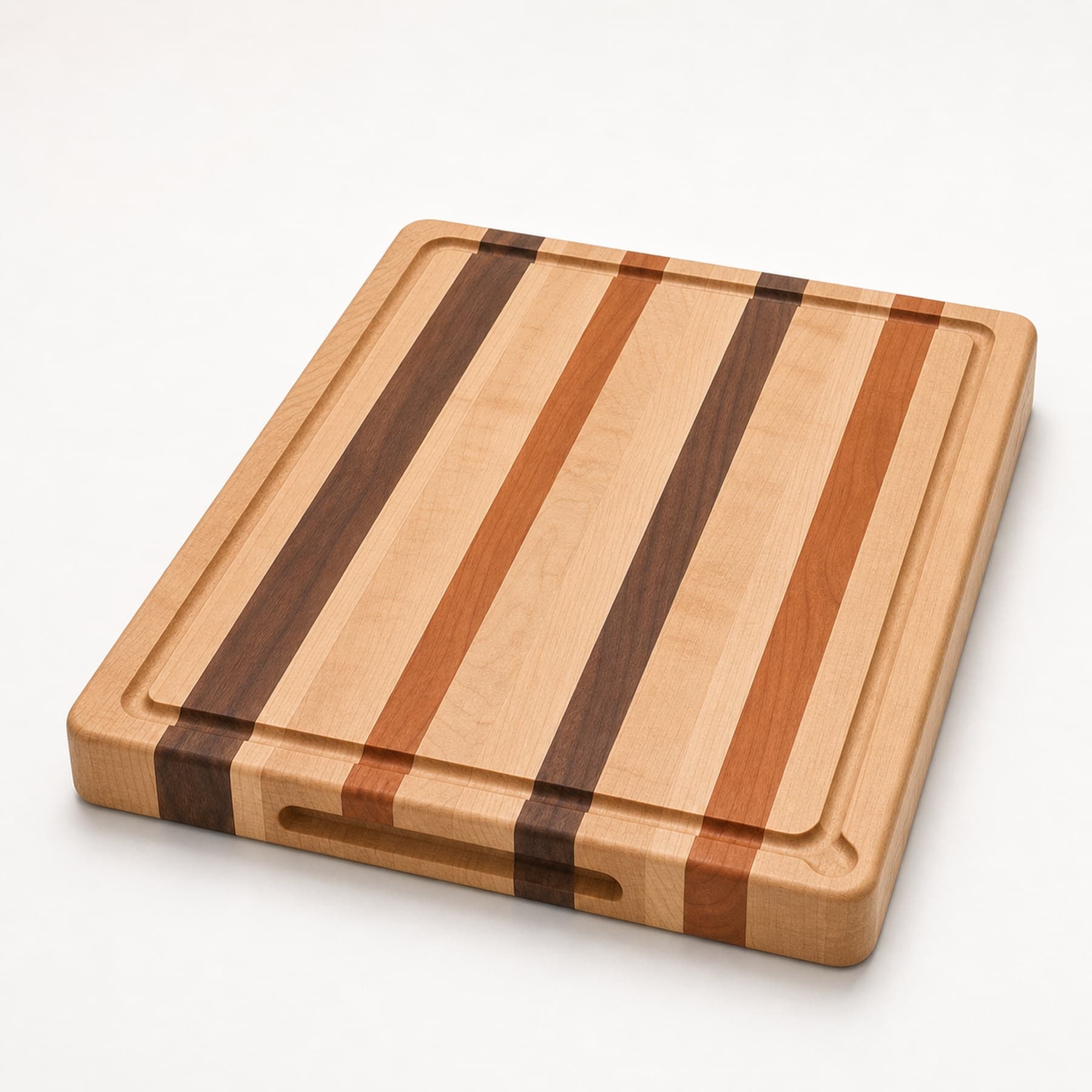 Deep Groove Carving Board photographed on a warm white product surface