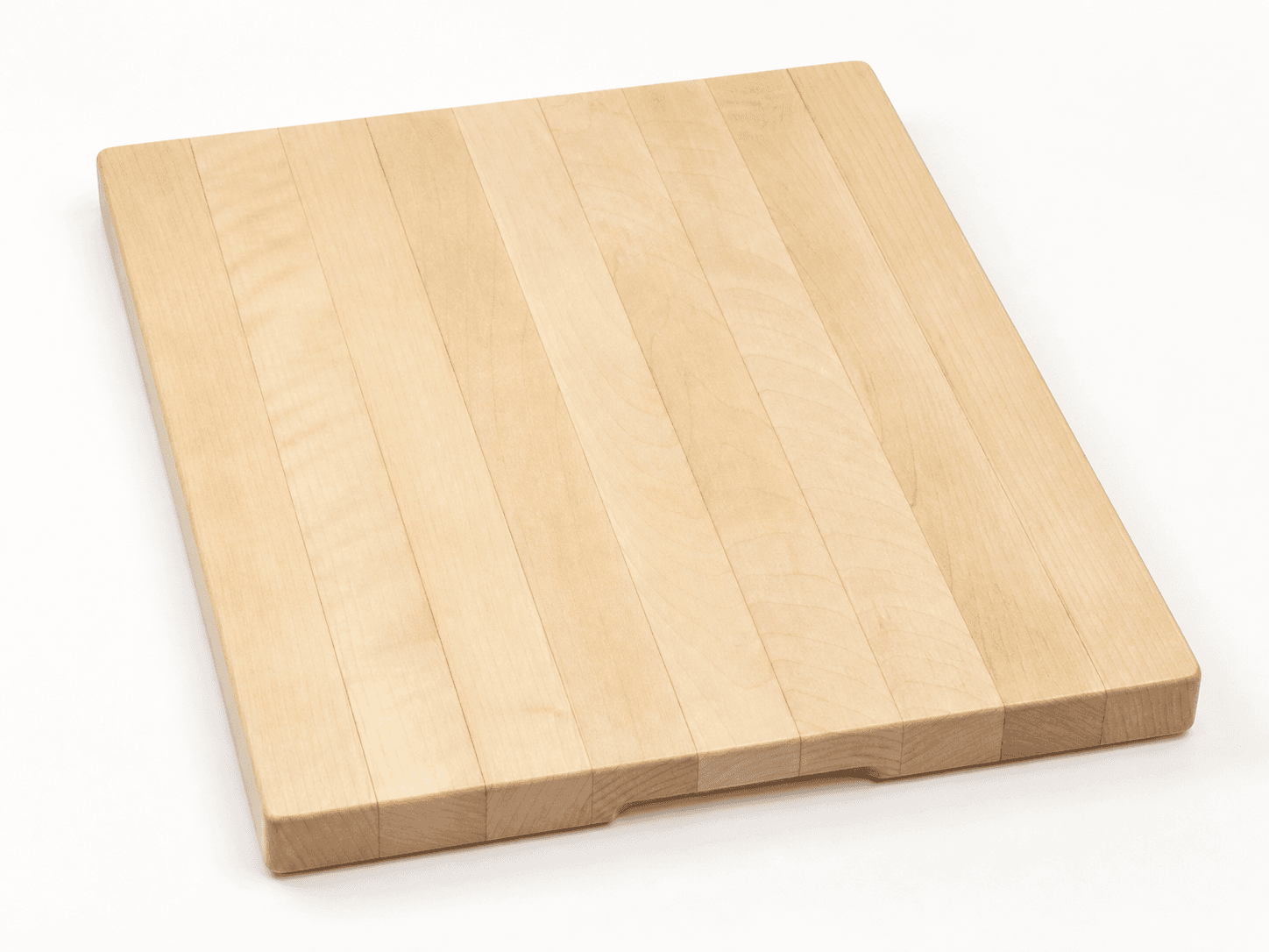 Thick pale hard maple edge-grain cutting board with recessed underside grips