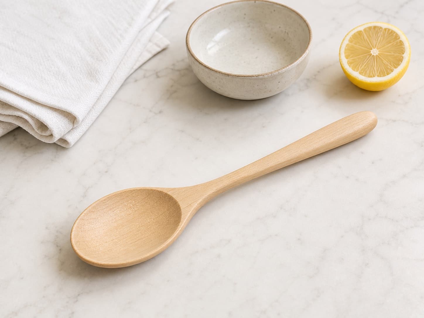 Broad Serving Spoon shown with everyday kitchen items for scale