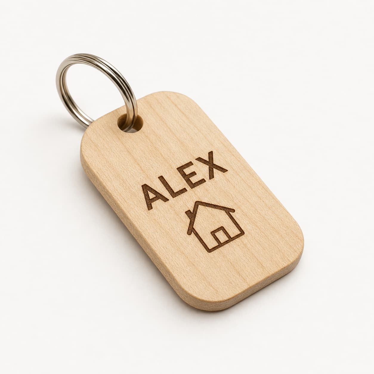 Personalized hard maple keychain engraved with Alex and a small house icon