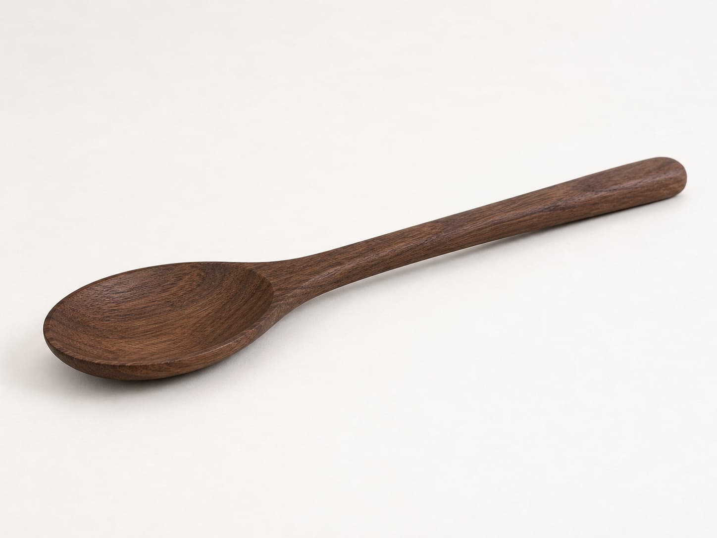 Low side angle showing the thickness and edge profile of Classic Cooking Spoon