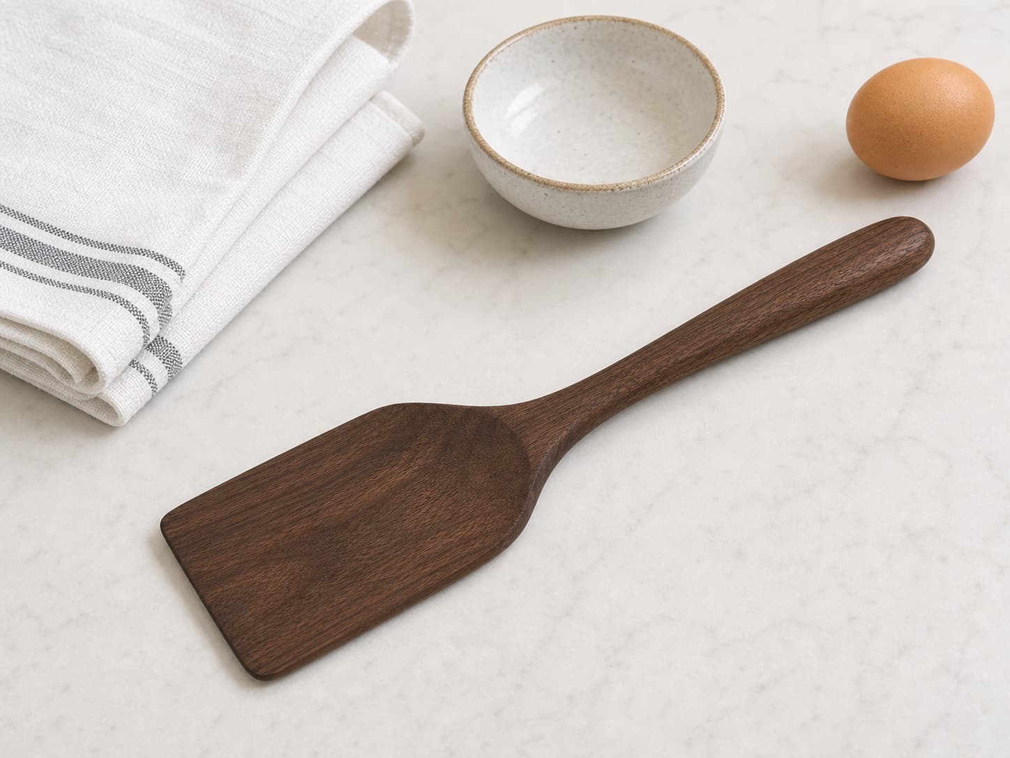 Flat Spatula Turner shown with everyday kitchen items for scale