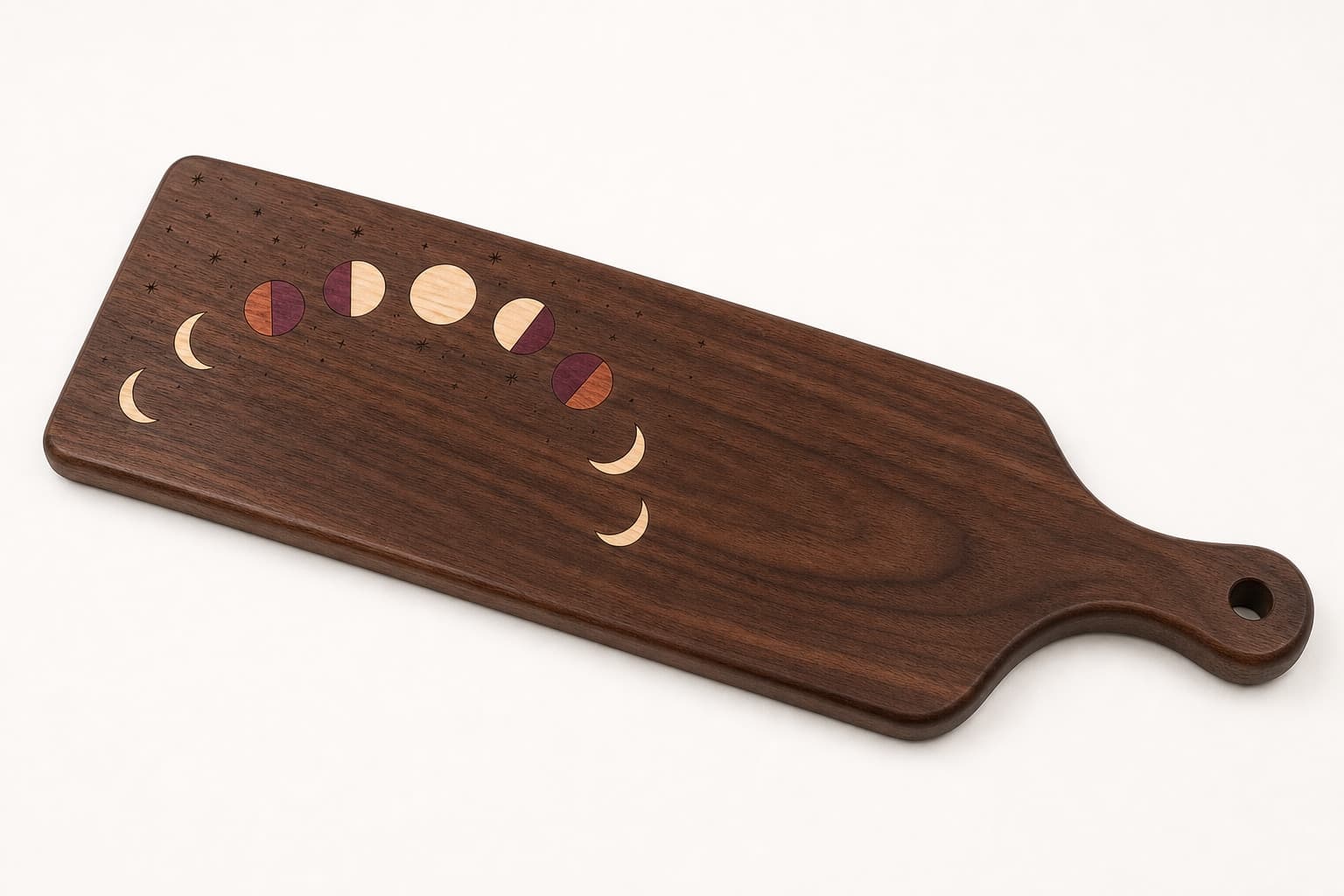 Celestial Moon Phase Walnut Paddle Board photographed on a warm white product surface