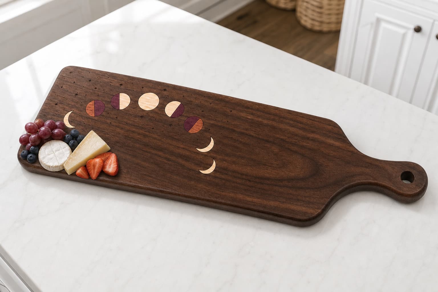 Celestial Moon Phase Walnut Paddle Board serving cheese and fruit on a kitchen island
