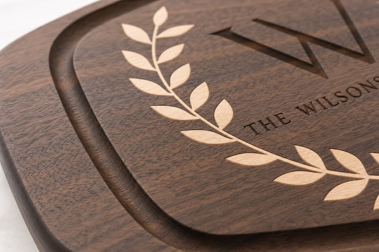 Close grain and material detail of Custom Wedding Crest Walnut Board