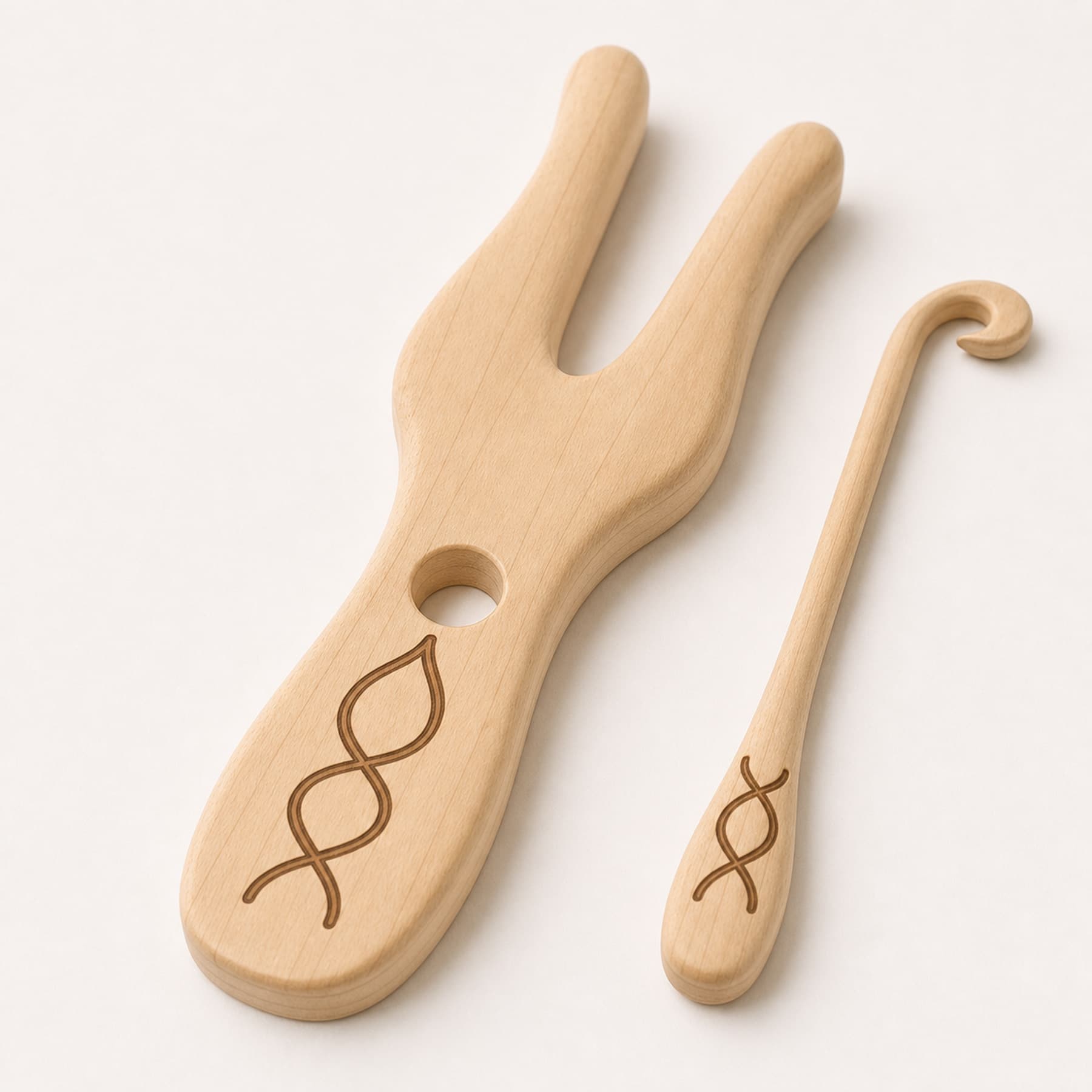Close view of the rounded maple edges, guide hole, hook, and laser engraving