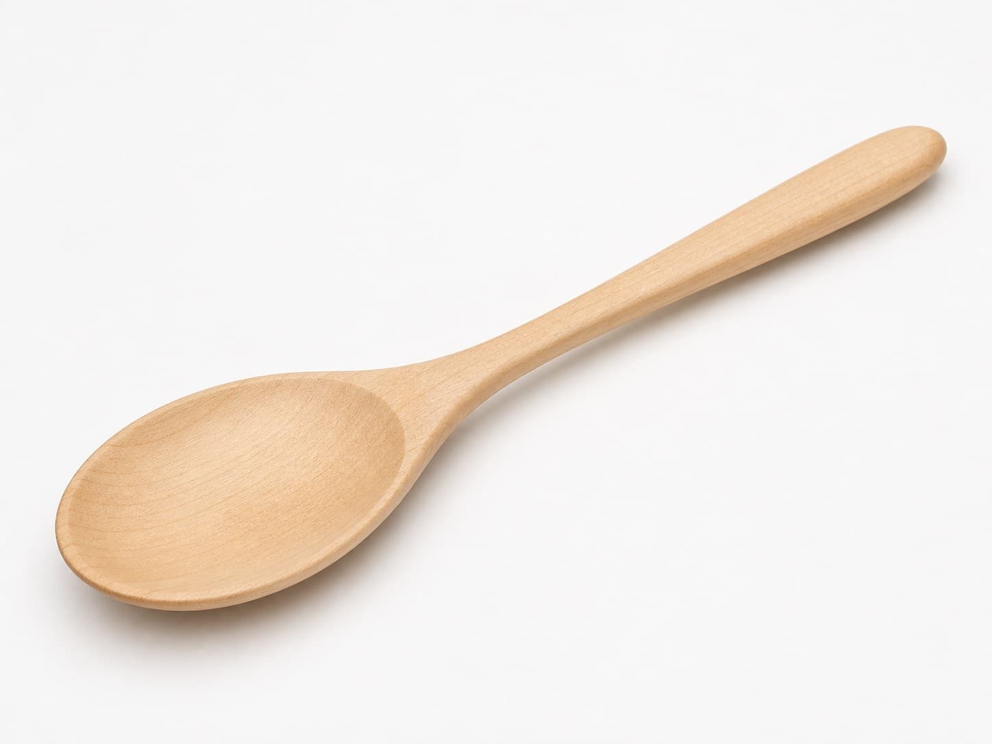 Broad serving spoon with rounded bowl shown in hard maple