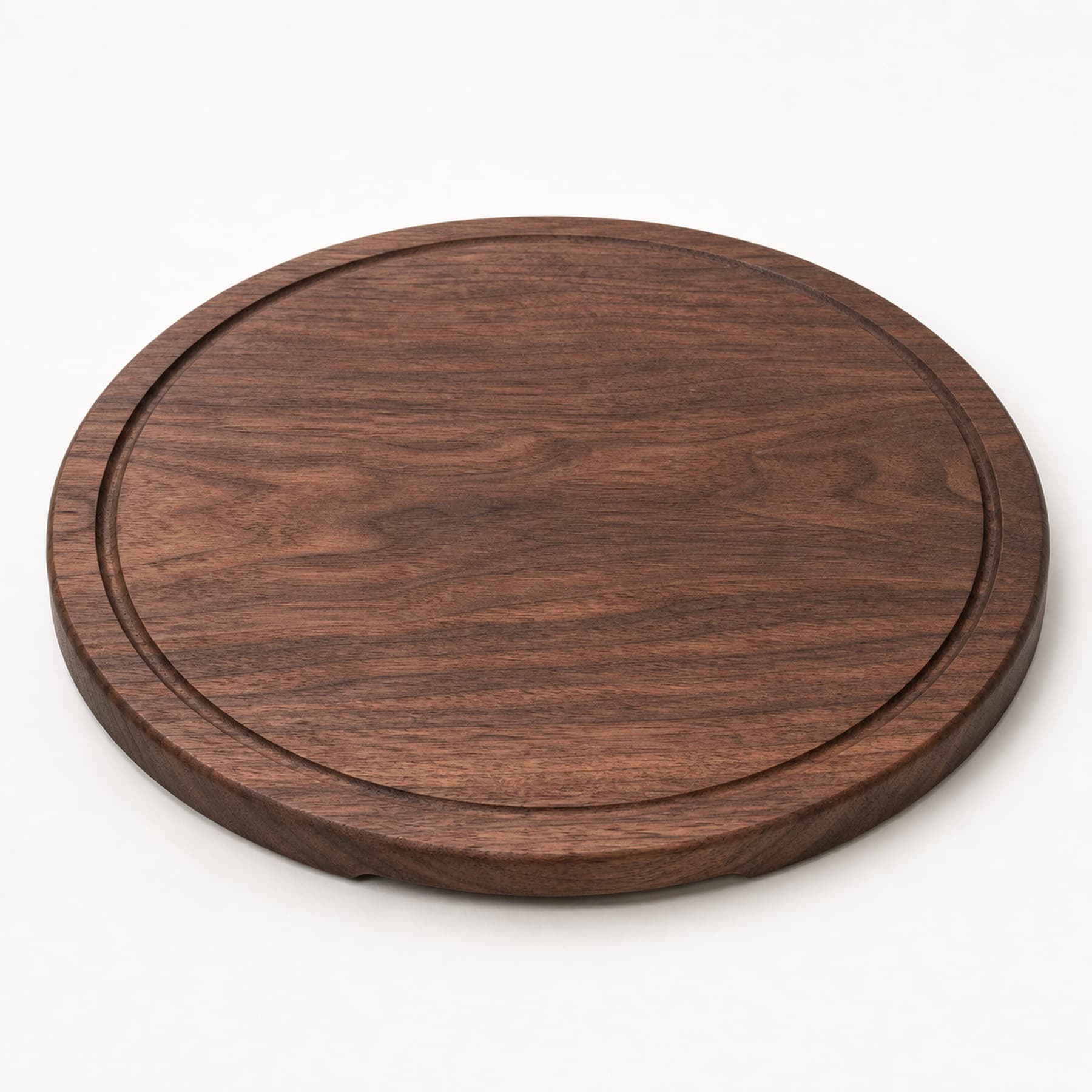 Round Walnut Serving Board photographed on a warm white product surface