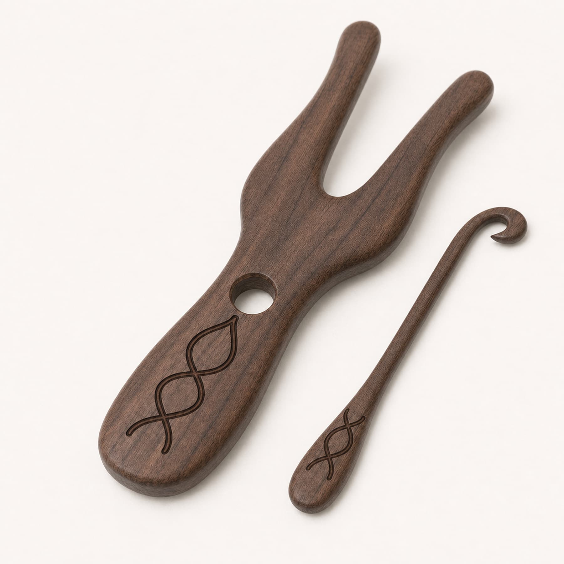 Close view of the rounded walnut edges, guide hole, hook, and laser engraving