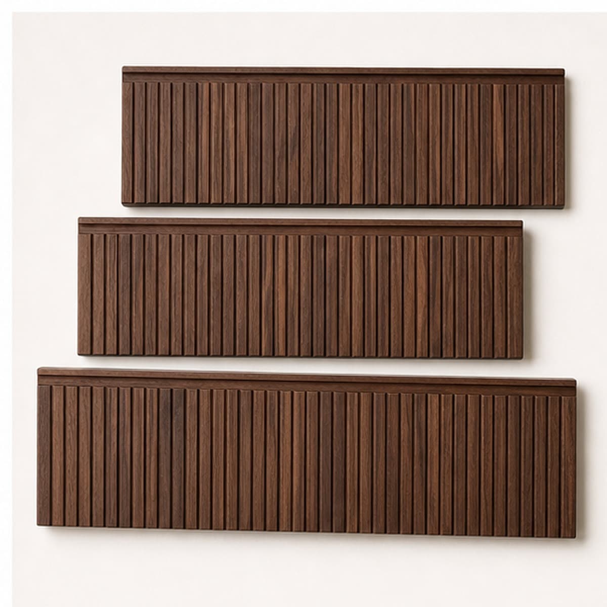 Three black walnut reeded drawer fronts with routed finger pulls